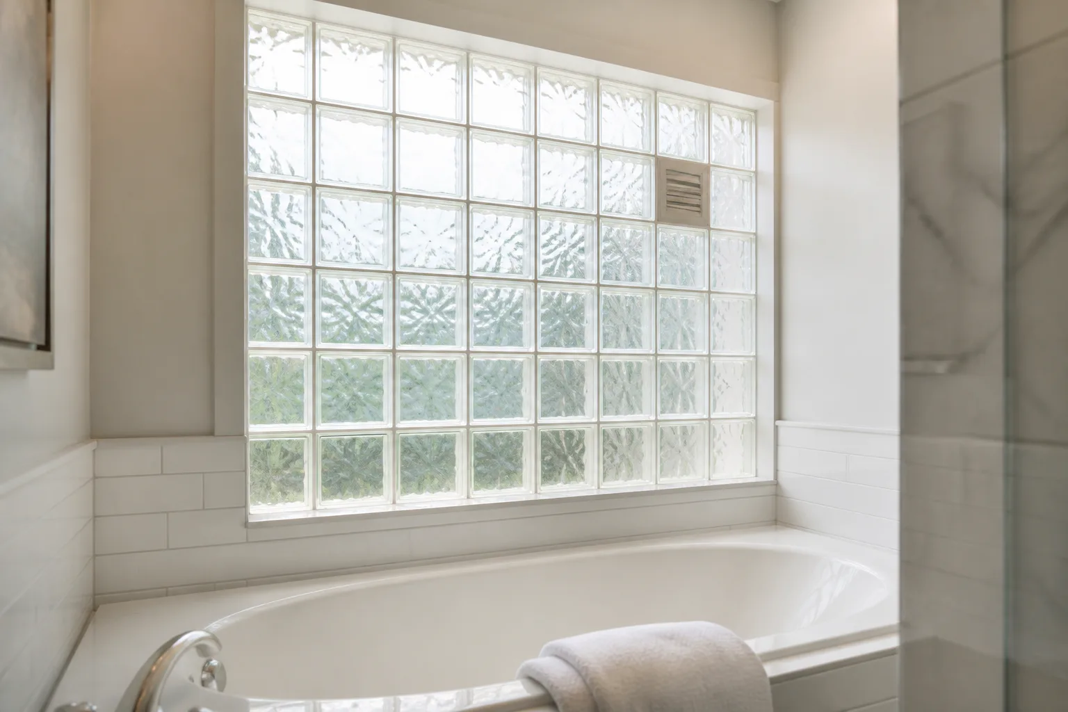Bathtub by glass block window